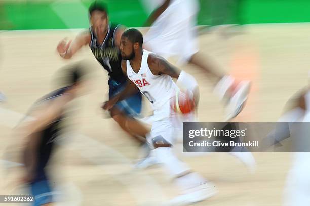 Kyrie Irving of United States drives on Facundo Campazzo of Argentina during the Men's Quarterfinal match on Day 12 of the Rio 2016 Olympic Games at...