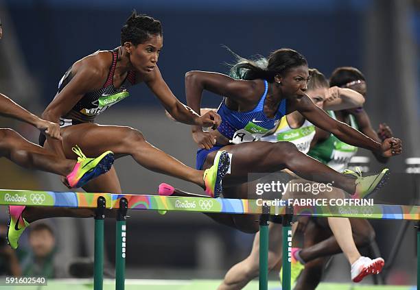 S Nia Ali Canada's Phylicia George compete in the Women's 100m Hurdles Semifinal during the athletics event at the Rio 2016 Olympic Games at the...