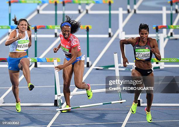 Puerto Rico's Jasmine Camacho-Quinn misses a hurdle while competing with Finland's Nooralotta Neziri and Canada's Phylicia George compete in the...