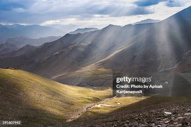 sun beam on the long roads in leh ladakh, india - kashmir landscape stock pictures, royalty-free photos & images