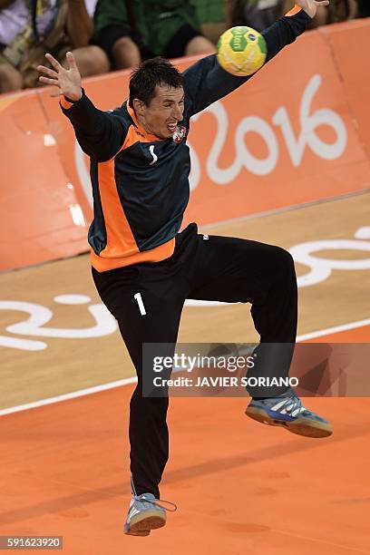 Poland's goalkeeper Slawomir Szmal tries to stop the ball during the men's quarterfinal handball match Croatia vs poland for the Rio 2016 Olympics...