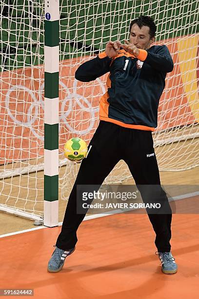 Poland's goalkeeper Slawomir Szmal tries to stop the ball during the men's quarterfinal handball match Croatia vs poland for the Rio 2016 Olympics...