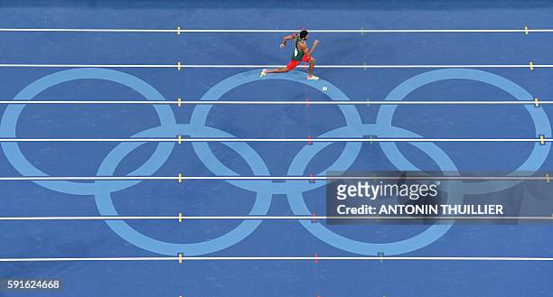 Algeria's Larbi Bourrada competes in the Men's Decathlon 400m during the athletics event at the Rio 2016 Olympic Games at the Olympic Stadium in Rio...