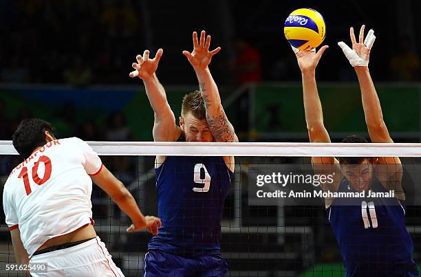Ivan Zaytsev and Simone Buti of Italy in action against Iran during the Men's Quarterfinal Volleyball match on Day 12 of the Rio 2016 Olympic Games...