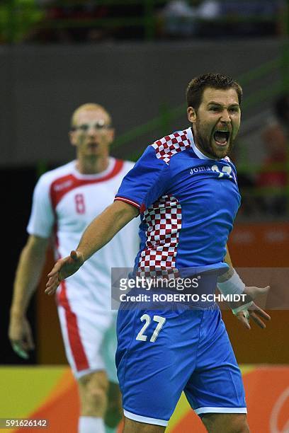 Croatia's right back Ivan Cupic celebrates a goal during the men's quarterfinal handball match Croatia vs poland for the Rio 2016 Olympics Games at...