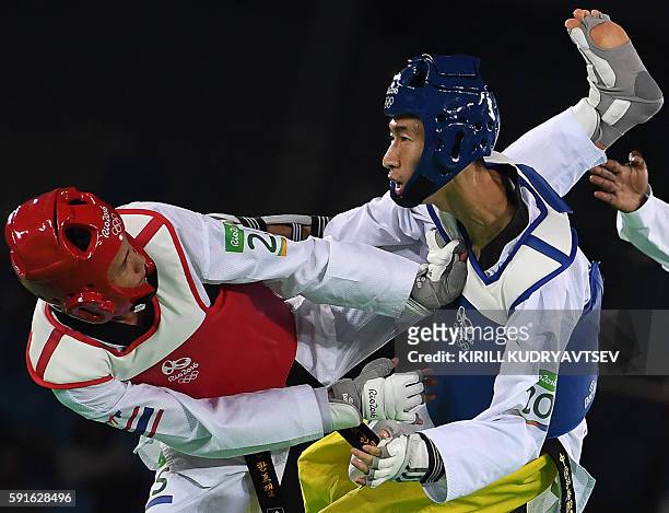 Thailand's Tawin Hanprab competes against China's Zhao Shuai in the men's taekwondo gold medal bout in the -58kg category as part of the Rio 2016...