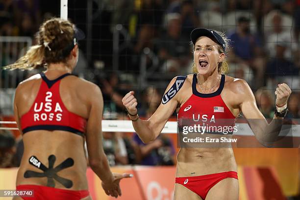 Kerri Walsh Jennings and April Ross of the United States celebrate a point during the Beach Volleyball Women's Bronze medal match against Larissa...