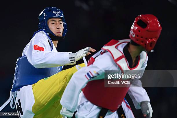 Zhao Shuai of China competes against Tawin Hanprab of Thailand during the Taekwondo Men's -58kg Gold Medal contest during Day 12 of the Rio 2016...