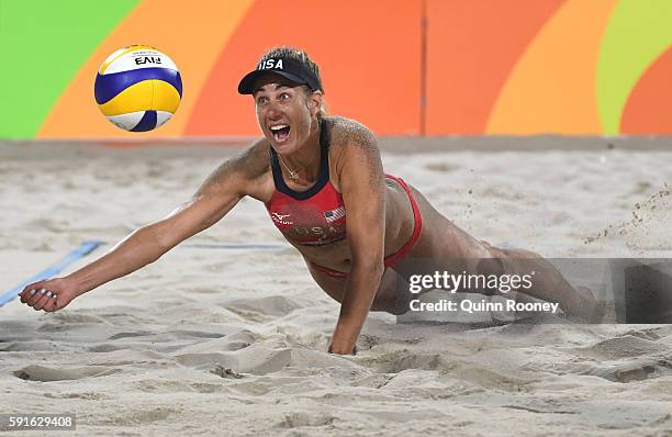 April Ross of the United States plays a shot during the Beach Volleyball Women's Bronze medal match against Larissa Franca Maestrini and Talita Rocha...