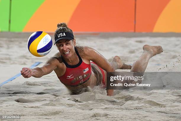 April Ross of the United States plays a shot during the Beach Volleyball Women's Bronze medal match against Larissa Franca Maestrini and Talita Rocha...