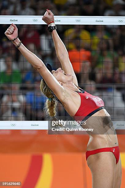 Kerri Walsh Jennings of the United States celebrates winning match point during the Beach Volleyball Women's Bronze medal match against Larissa...