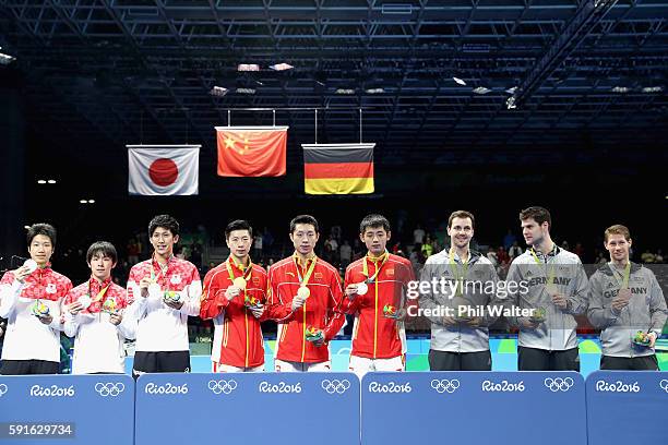 Silver medalists Jun Mizutani, Maharu Yoshimura and Koki Niwa of Japan, gold medalists Long Ma, Xin Xu, and Jike Zhang of China and bronze medalists...