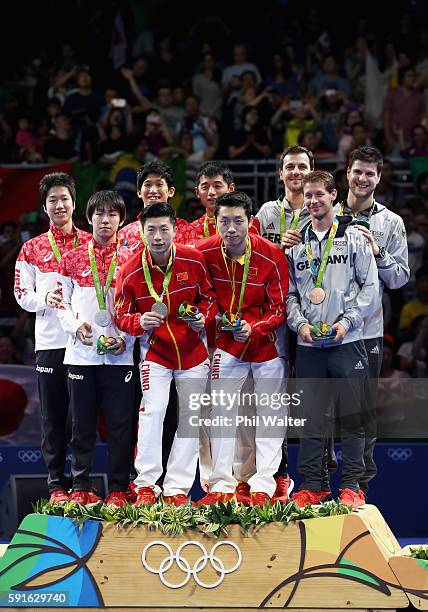 Silver medalists Jun Mizutani, Maharu Yoshimura and Koki Niwa of Japan, gold medalists Long Ma, Xin Xu, and Jike Zhang of China and bronze medalists...