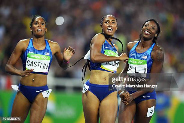 Bronze medalist Kristi Castlin, gold medalist Brianna Rollins and silver medalist Nia Ali of the United States react after the Women's 100m Hurdles...