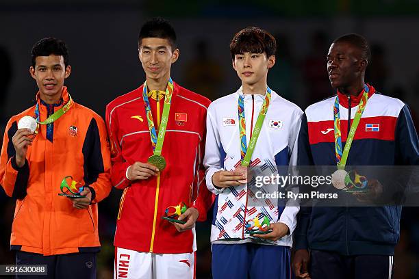 Silver medalist Tawin Hanprab of Thailand, gold medalist Shuai Zhao of China, bronze medalist Taehun Kim of Korea and bronze medalist Luisito Pie of...