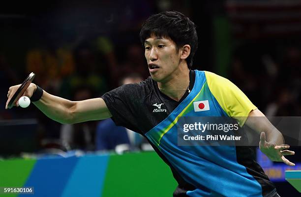 Maharu Yoshimura of Japan competes during the Men's Table Tennis gold medal match against Long Ma of China at Riocentro - Pavilion 3 on Day 12 of the...