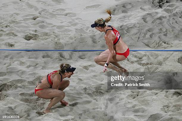 Kerri Walsh Jennings and April Ross of the United States celebrate winning match point during the Beach Volleyball Women's Bronze medal match against...