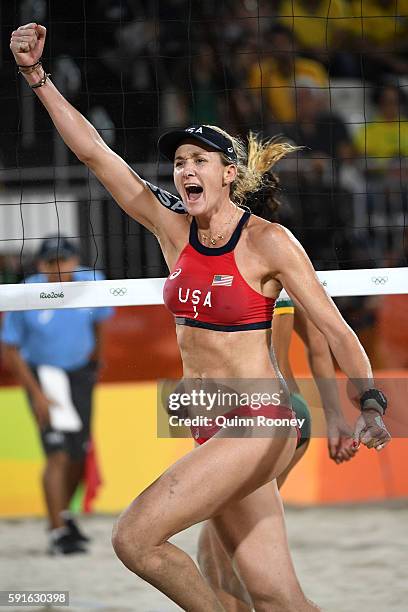 Kerri Walsh Jennings of the United States celebrates winning match point during the Beach Volleyball Women's Bronze medal match against Larissa...