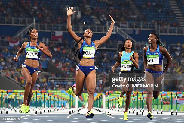 Gold medallist USA's Brianna Rollins celebrates as she crosses the finish line ahead of silver medallist USA's Nia Ali and bronze medallist USA's...