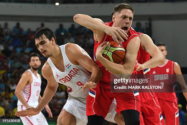 Serbia's centre Vladimir Stimac vies with Croatia's forward Dario Saric during a Men's quarter final basketball match between Serbia and Croatia at...