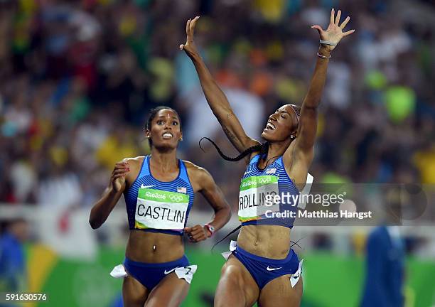 Bronze medalist Kristi Castlin of the United States and gold medalist Brianna Rollins of the United States react as they finish the Women's 100m...