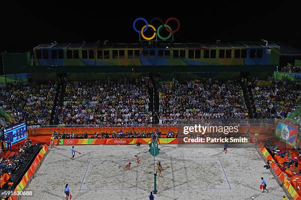 Kerri Walsh Jennings and April Ross of the United States celebrate winning match point during the Beach Volleyball Women's Bronze medal match against...