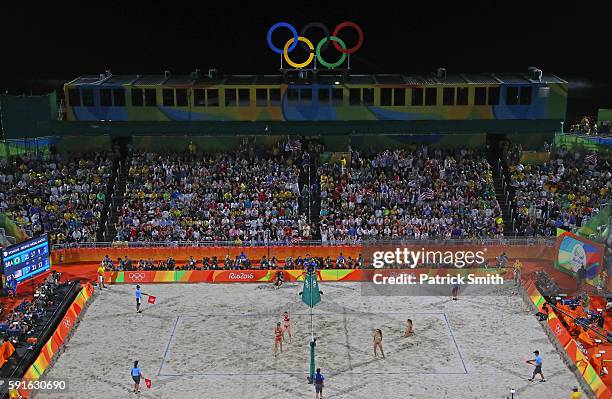 Kerri Walsh Jennings and April Ross of the United States celebrate winning match point during the Beach Volleyball Women's Bronze medal match against...