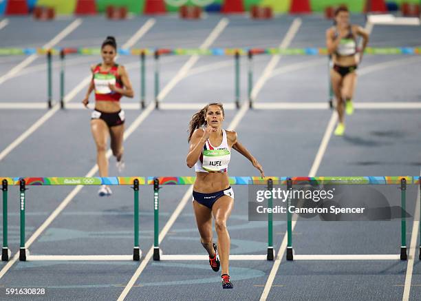 Amalie Iuel of Norway competes during the Women's 400m Hurdles Round 1 on Day 10 of the Rio 2016 Olympic Games at the Olympic Stadium on August 15,...