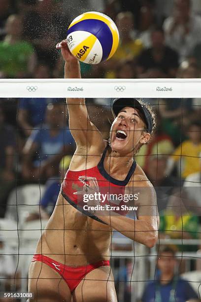 April Ross of the United States plays a shot during the Beach Volleyball Women's Bronze medal match against Larissa Franca Maestrini and Talita Rocha...