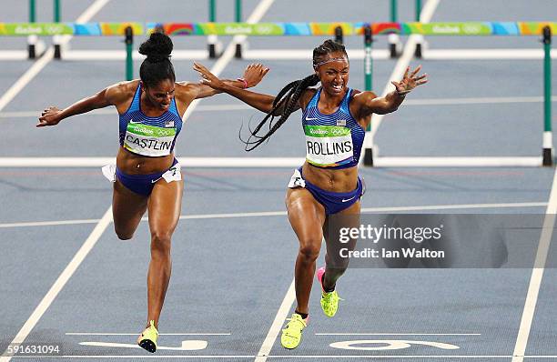 Bronze medalist Kristi Castlin of the United States and gold medalist Brianna Rollins of the United States celebrate as they finish the Women's 100m...