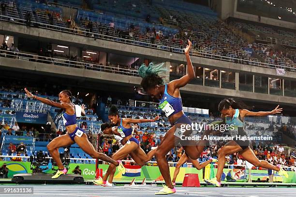 Brianna Rollins of the United States wins the gold medal in the Women's 100m Hurdles Final ahead of silver medalist Nia Ali of the United States and...