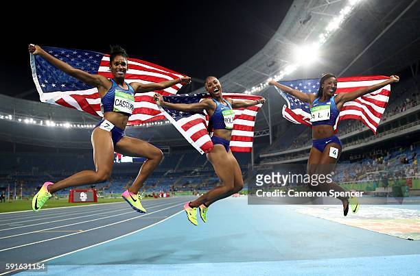 Bronze medalist Kristi Castlin, gold medalist Brianna Rollins and silver medalist Nia Ali of the United States celebrate with American flags after...