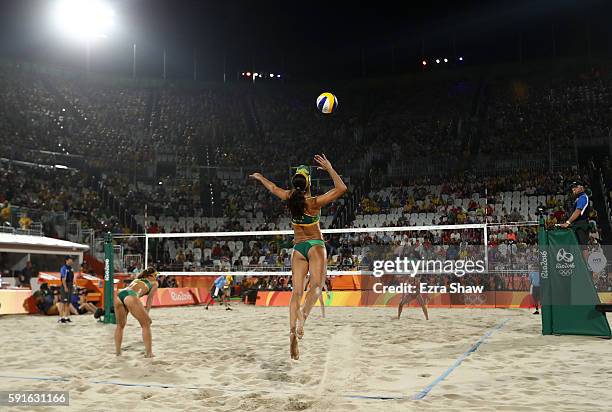 Talita Rocha of Brazil serves the ball during the Beach Volleyball Women's Bronze medal match against Kerri Walsh Jennings of the United States and...