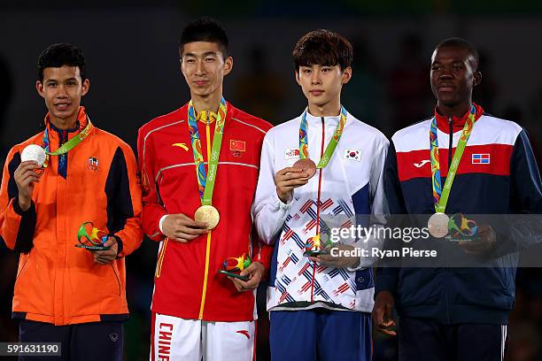 Silver medalist Tawin Hanprab of Thailand, gold medalist Shuai Zhao of China, bronze medalist Taehun Kim of Korea and bronze medalist Luisito Pie of...