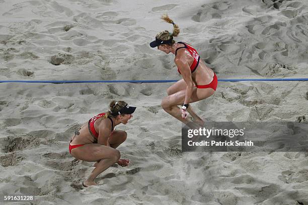 Kerri Walsh Jennings and April Ross of the United States celebrate winning match point during the Beach Volleyball Women's Bronze medal match against...