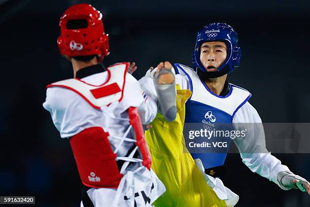 Zhao Shuai of China competes against Tawin Hanprab of Thailand during the Taekwondo Men's -58kg Gold Medal contest during Day 12 of the Rio 2016...