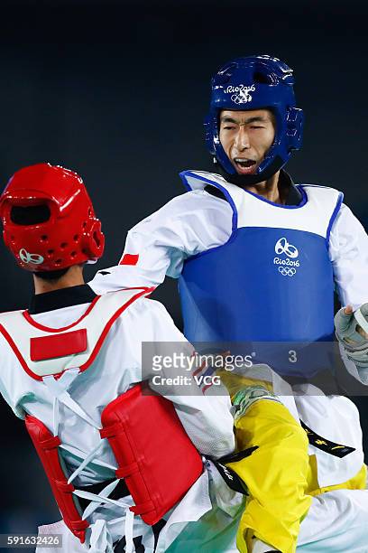 Zhao Shuai of China competes against Tawin Hanprab of Thailand during the Taekwondo Men's -58kg Gold Medal contest during Day 12 of the Rio 2016...