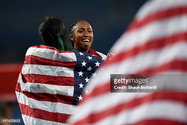 Silver medalist Nia Ali and gold medalist Brianna Rollins of the United States celebrate after the Women's 100m Hurdles Final on Day 12 of the Rio...