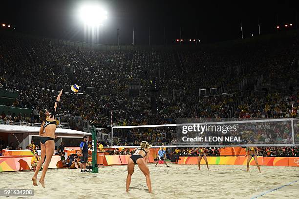 Germany's Kira Walkenhorst serves the ball during the women's beach volleyball final match between Brazil and Germany at the Beach Volley Arena in...