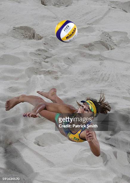 Barbara Seixas de Freitas of Brazil attempts to play a shot during the Beach Volleyball Women's Gold medal match against Laura Ludwig of Germany and...