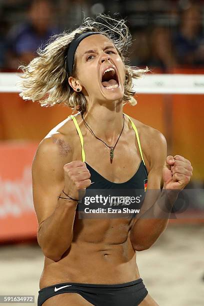 Laura Ludwig of Germany celebrates winning match point during the Beach Volleyball Women's Gold medal match against Agatha Bednarczuk Rippel of...