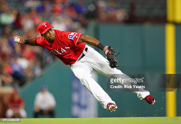 Adrian Beltre of the Texas Rangers throws out the runner on first base against the Oakland Athletics at Globe Life Park in Arlington on August 17,...