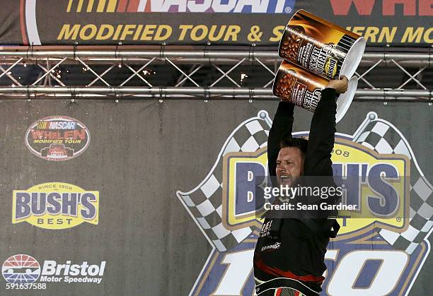 Eric Goodale, driver of the GAF Roofing/RBSCorp.com Chevrolet, celebrates after winning the NASCAR Whelen Modified Tours Bush's Beans 150 at Bristol...