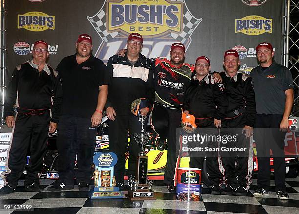 Eric Goodale, driver of the GAF Roofing/RBSCorp.com Chevrolet, celebrates with his team after winning the NASCAR Whelen Modified Tours Bush's Beans...