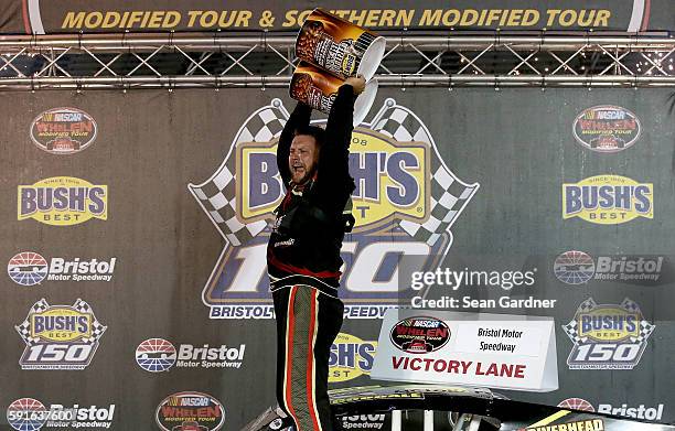 Eric Goodale, driver of the GAF Roofing/RBSCorp.com Chevrolet, celebrates after winning the NASCAR Whelen Modified Tours Bush's Beans 150 at Bristol...