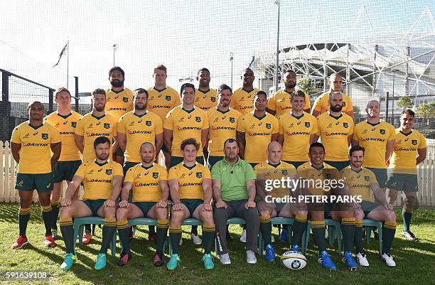 Australian rugby players pose for a team photo with coach Michael Cheika who announced the squad for the upcoming the Bledisloe Cup game against New...