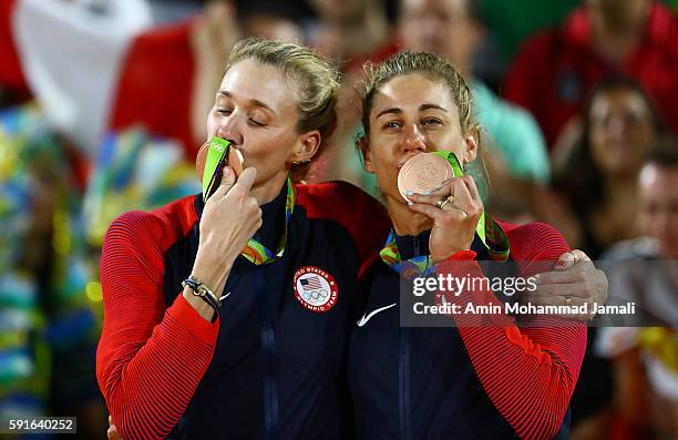 Bronze medalists Kerri Walsh Jennings and April Ross of the United States pose on the podium during the medal ceremony for the Women's Beach...