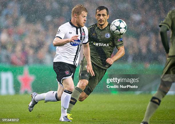 Daryl Horgan of Dundalk and Tomasz Jodlowiec of Legia fight for the ball during the UEFA Champions League Play-Offs 1st leg between Dundalk FC and...