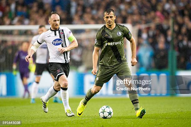 Tomasz Jodlowiec of Legia and Stephen O'Donnell of Dundalk in action during the UEFA Champions League Play-Offs 1st leg between Dundalk FC and Legia...