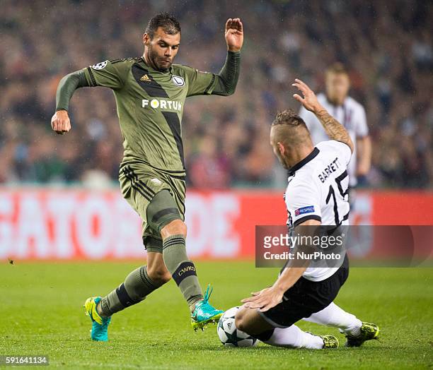 Nemanja Nikolic of Legia fights for the ball with Patrick Barrett of Dundalk during the UEFA Champions League Play-Offs 1st leg between Dundalk FC...